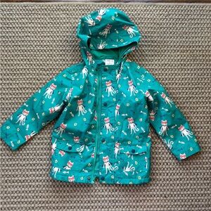 Cartwheels by Charlie Paige Teal Rain Jacket